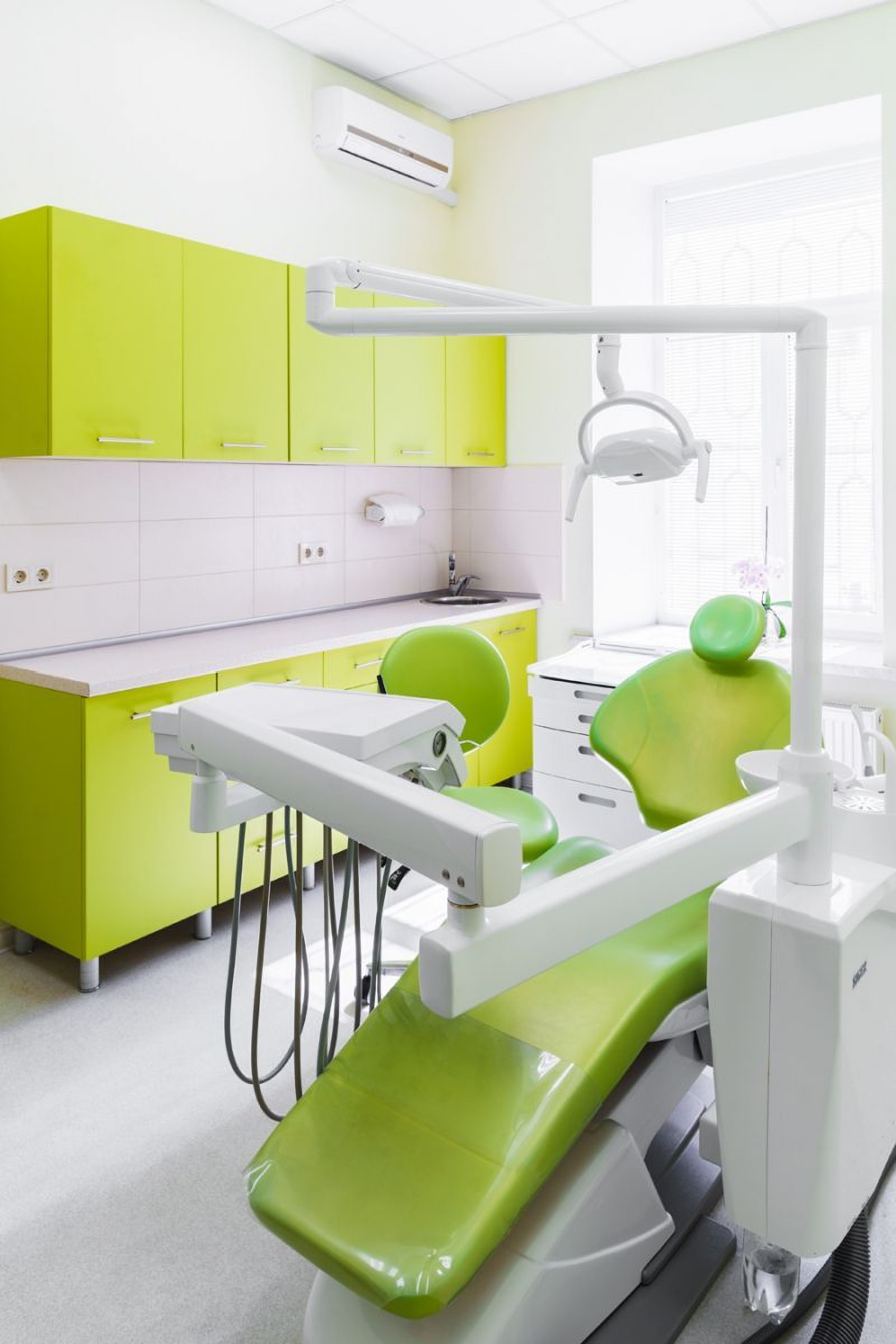 Green dental chair in TrioDent Odessa Ukraine clinic